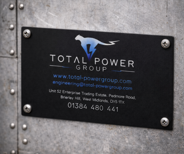 metal 600x500 hero image metal labels for total power fixed with screws in an industrial setting